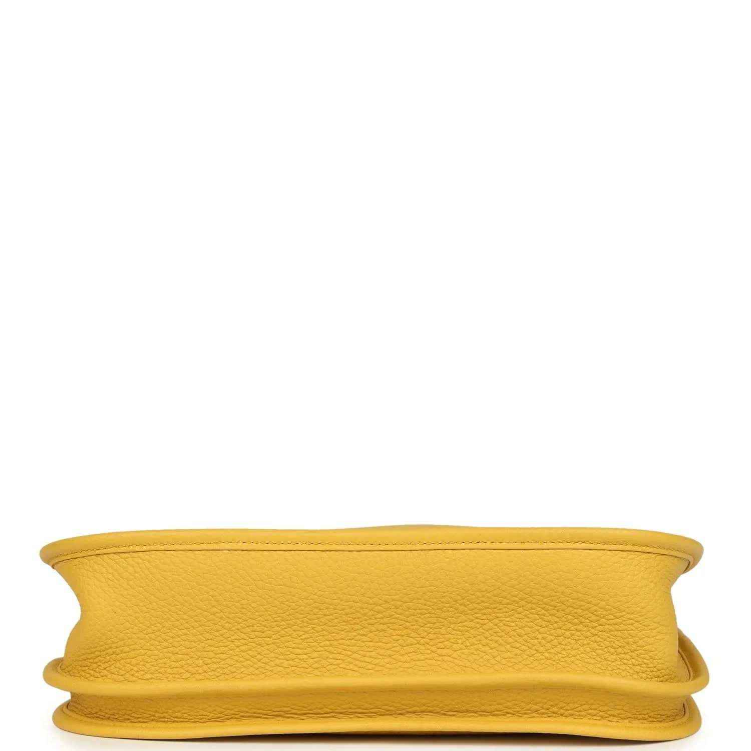 Yellow leather bag bottom view with stitched edging and rounded seam detail