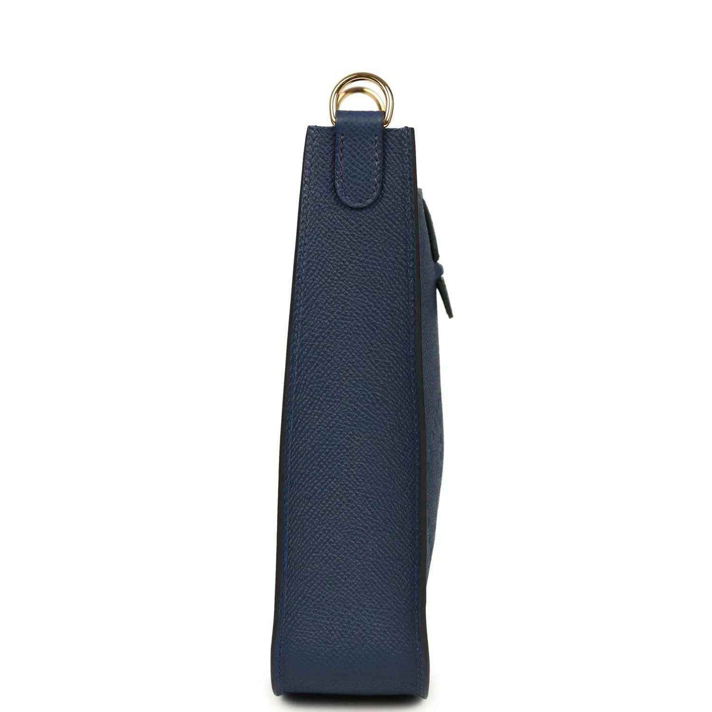 Hermes bag in blue with side panel, dangling tag, and gold-tone top ring
