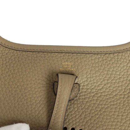Beige pebbled leather bag interior with Hermes Paris stamp on leather tab