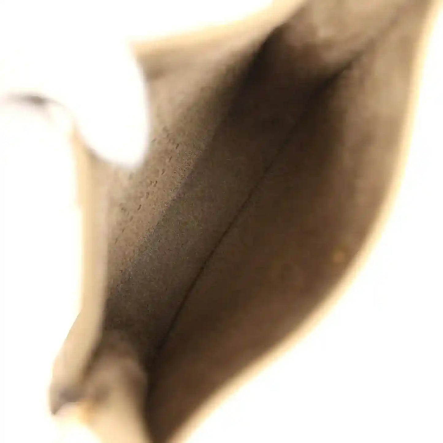 Beige leather interior corner of Evelyne TPM bag with visible stitching