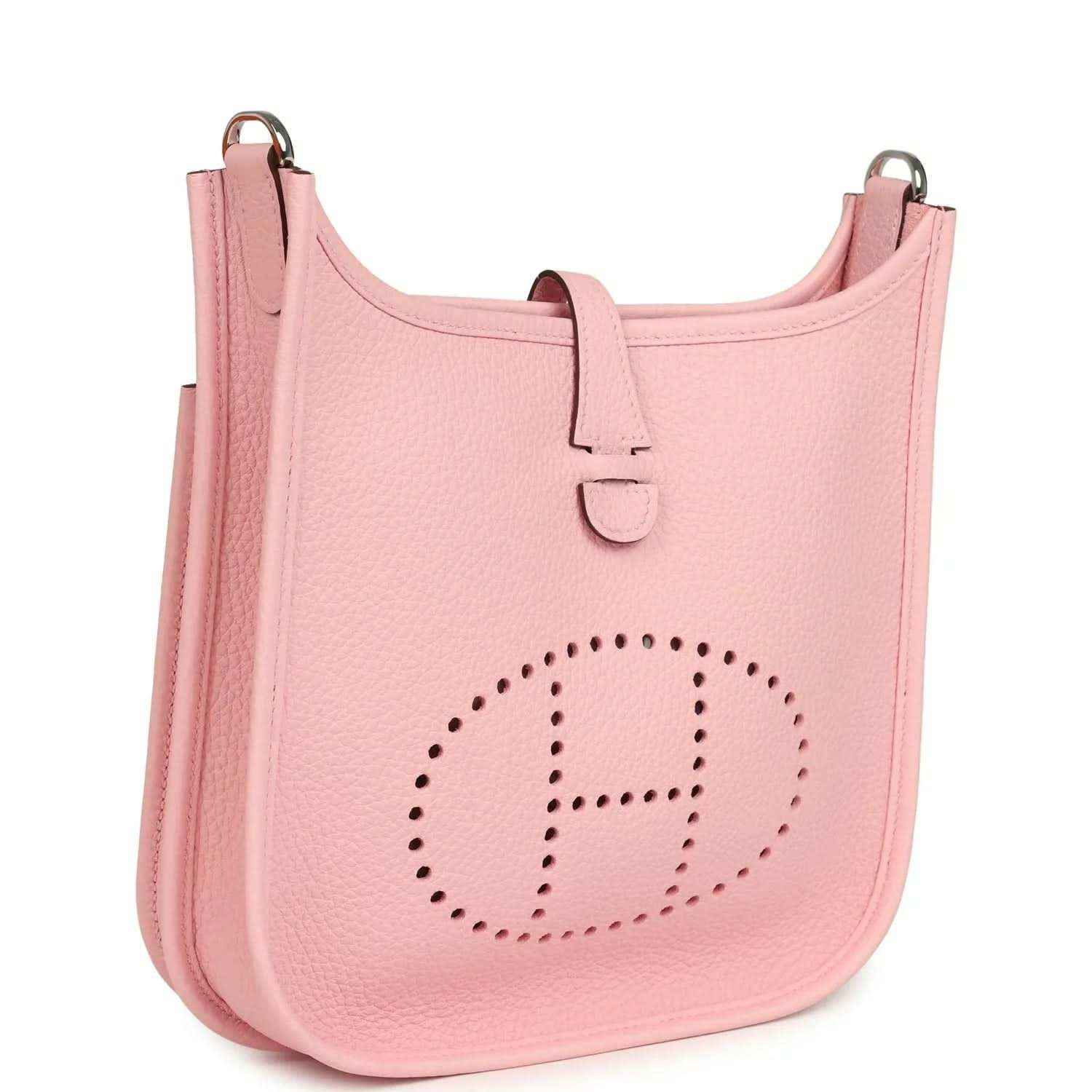 Hermes Evelyne 23 bag in rose pink leather, side view with dotted H logo and strap