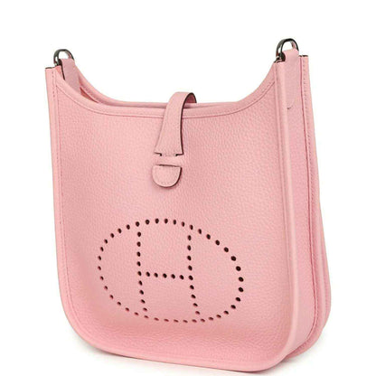 Hermes Evelyne 23 bag in rose pink leather, front view with dotted H logo and top strap