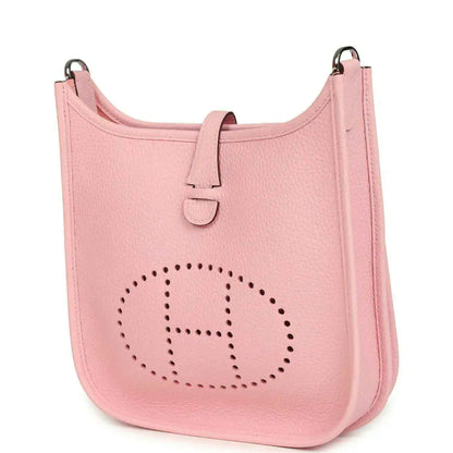 Hermes Evelyne 23 bag in rose pink leather, front view with dotted H logo and top strap
