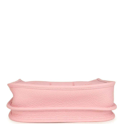 Hermes Evelyne 23 bag in rose pink leather, side view showing curved rim and reinforced edge