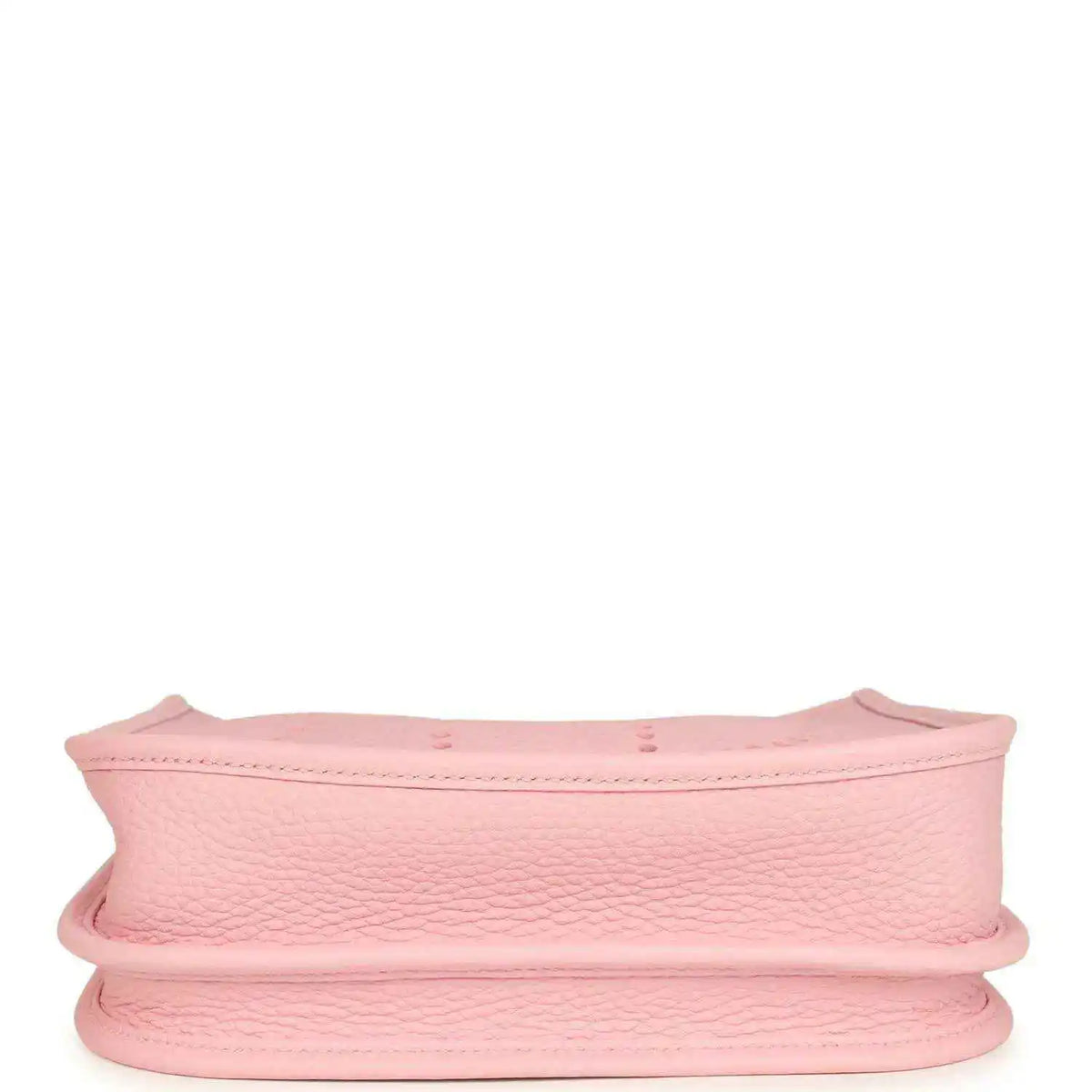 Hermes Evelyne 23 bag in rose pink leather, side view showing curved rim and reinforced edge