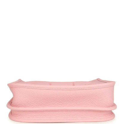 Hermes Evelyne 23 bag in rose pink leather, side view showing curved rim and reinforced edge