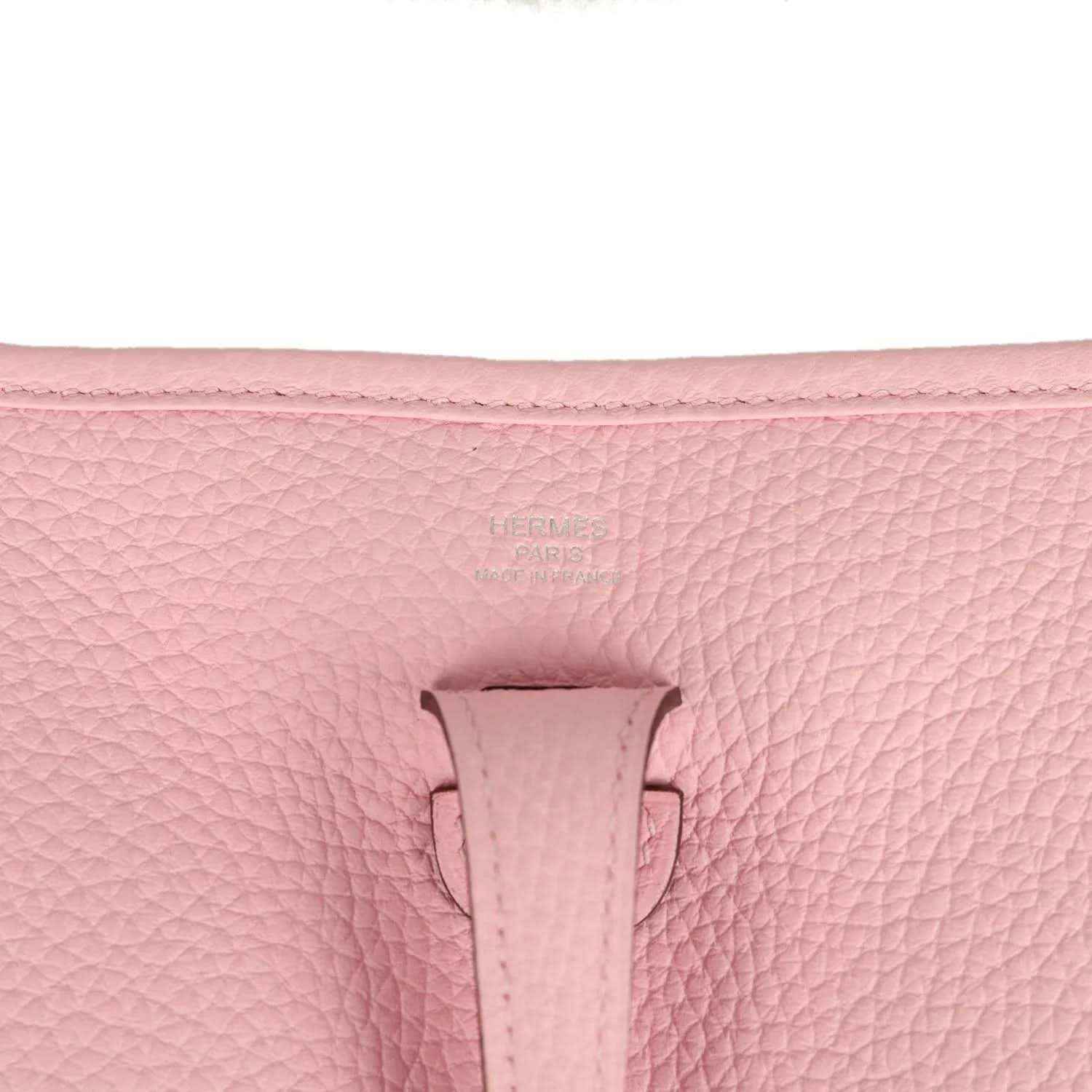 Hermes Evelyne 23 bag in rose pink leather, close-up of front tab and textured grain