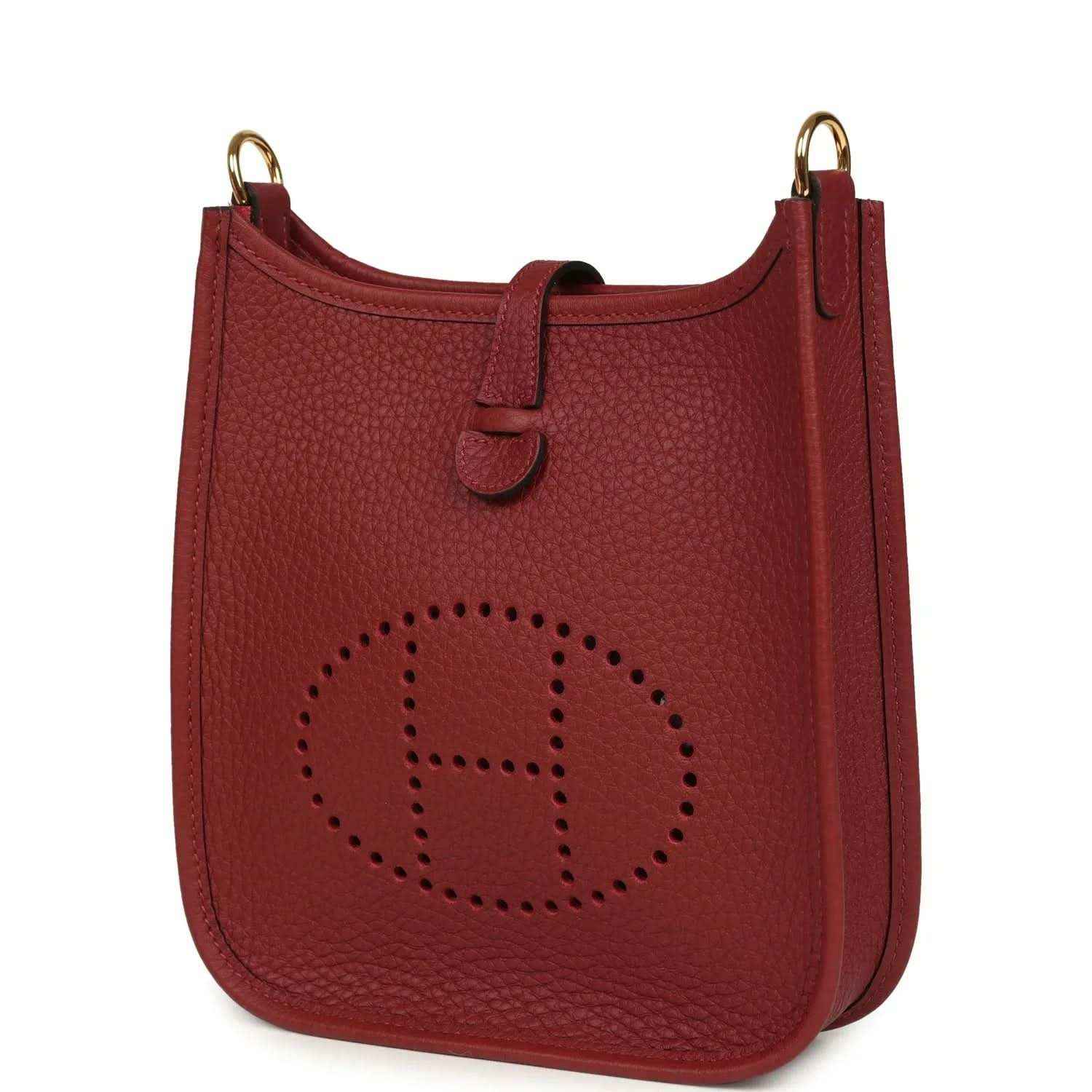 Red textured leather small bag with top handle and perforated logo panel