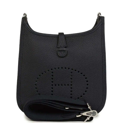 Black leather crossbody bag with perforated logo and wrap strap detail