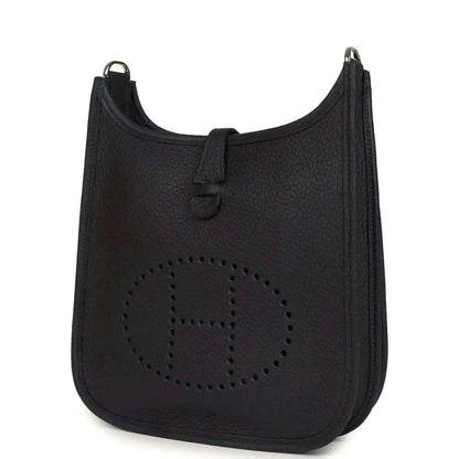 Black leather crossbody bag with perforated circle logo motif