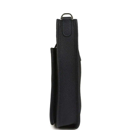 Black leather crossbody bag, vertical side view with top loop handle