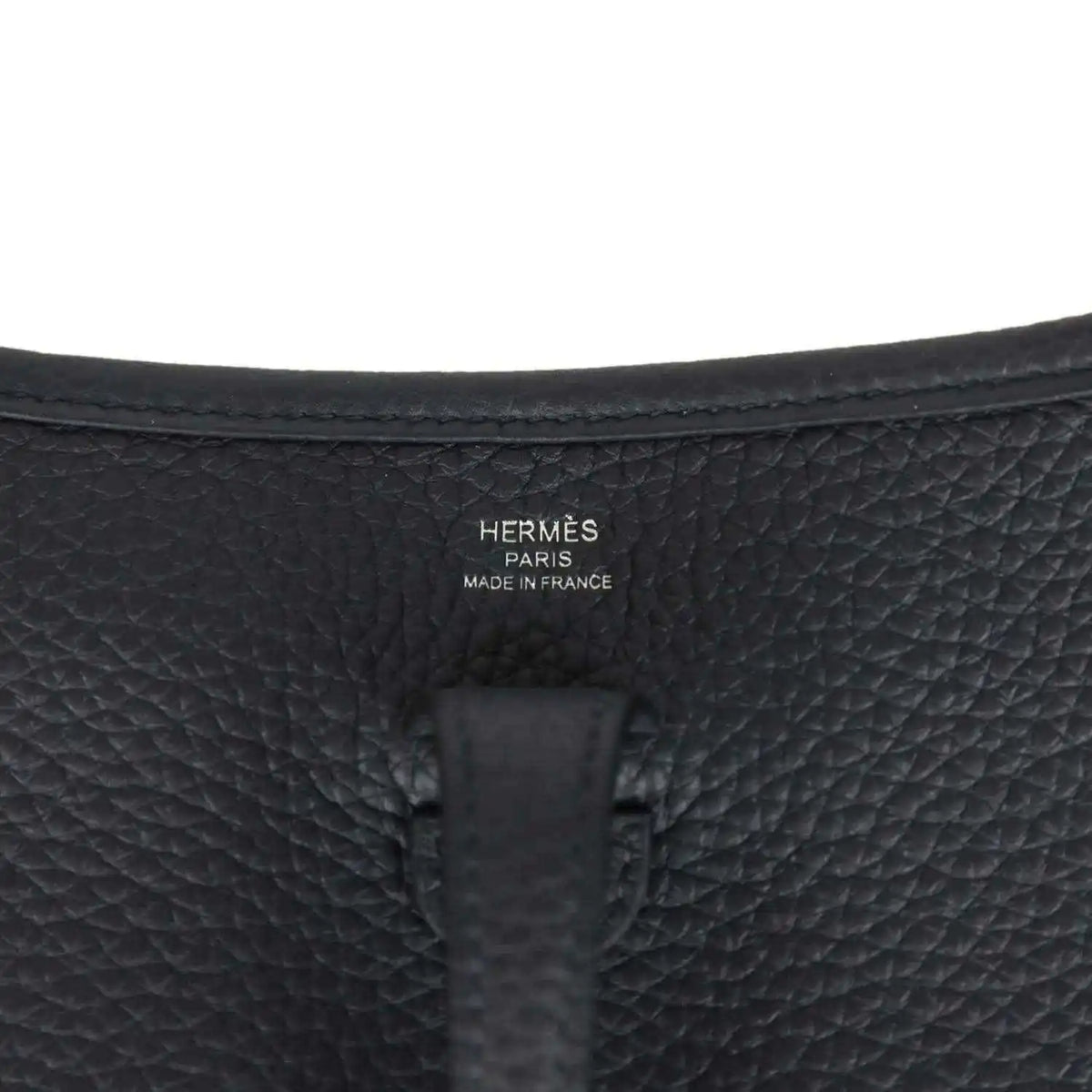 Hermes stamped black leather bag panel, embossed logo and Made in France