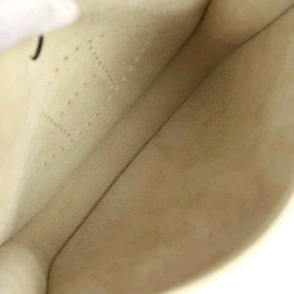 Cream leather bag interior with smooth lining and side seam stitching