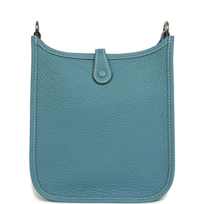 Blue denim leather mini messenger bag with top handles and centered tab closure