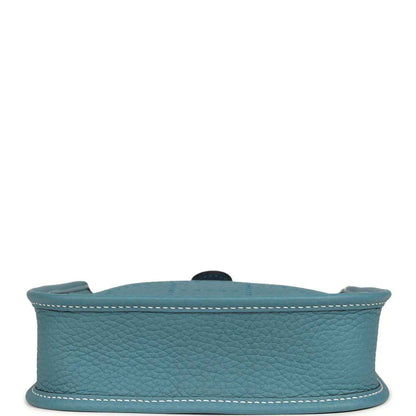 Blue denim leather mini messenger bag with top edge and riveted strap hardware