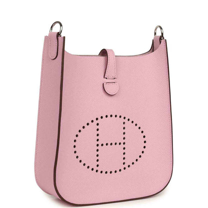 Mauve Evelyne Sellier TPM shoulder bag with top handle, front logo, and crossbody strap