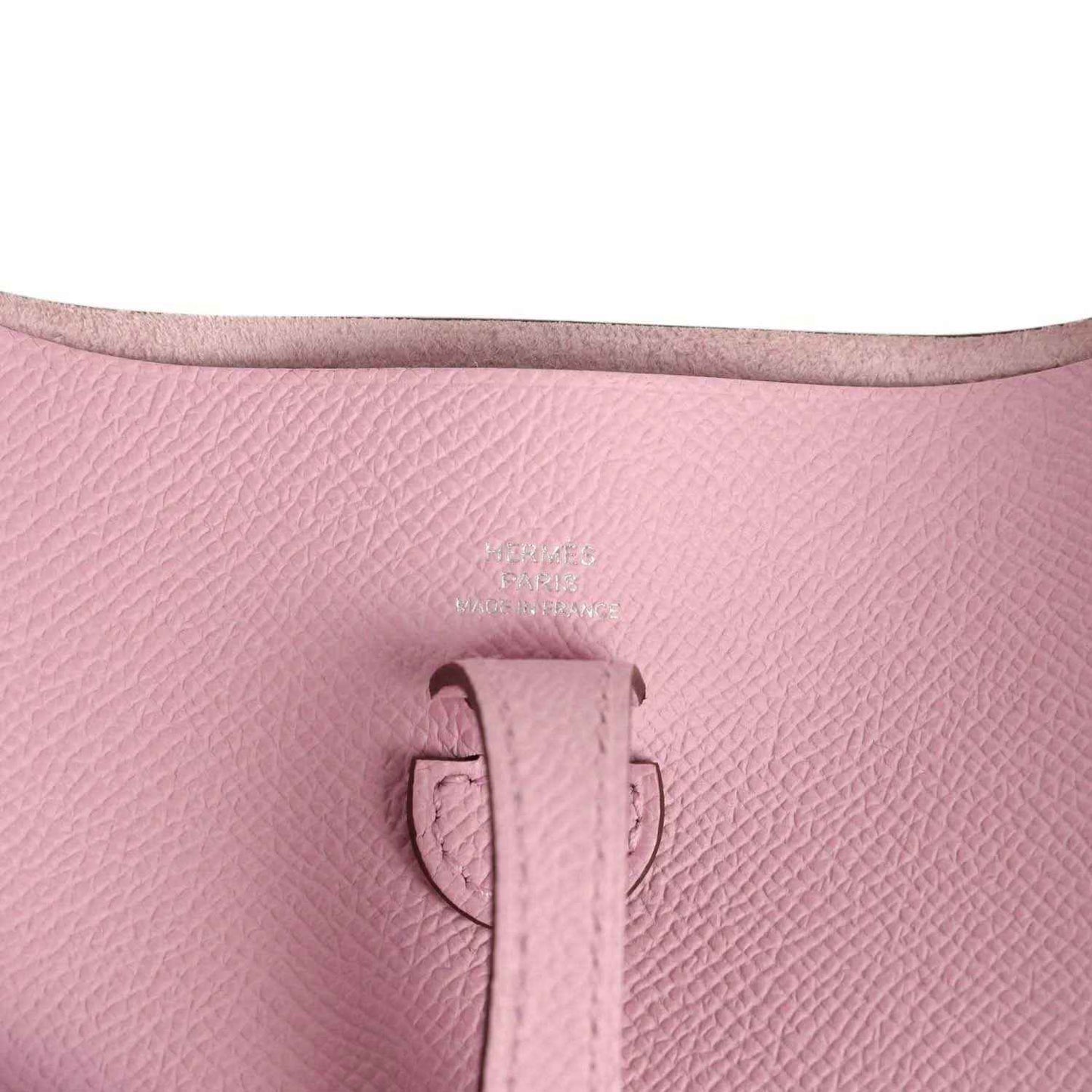 Mauve Epsom leather Evelyne Sellier TPM bag close-up of top tab and seam