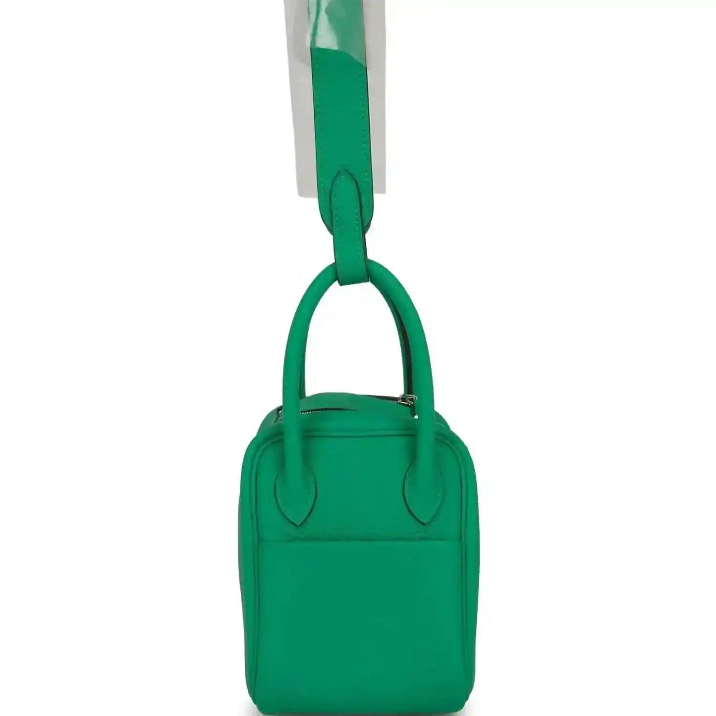 Mini green leather handbag with two short handles and compact body