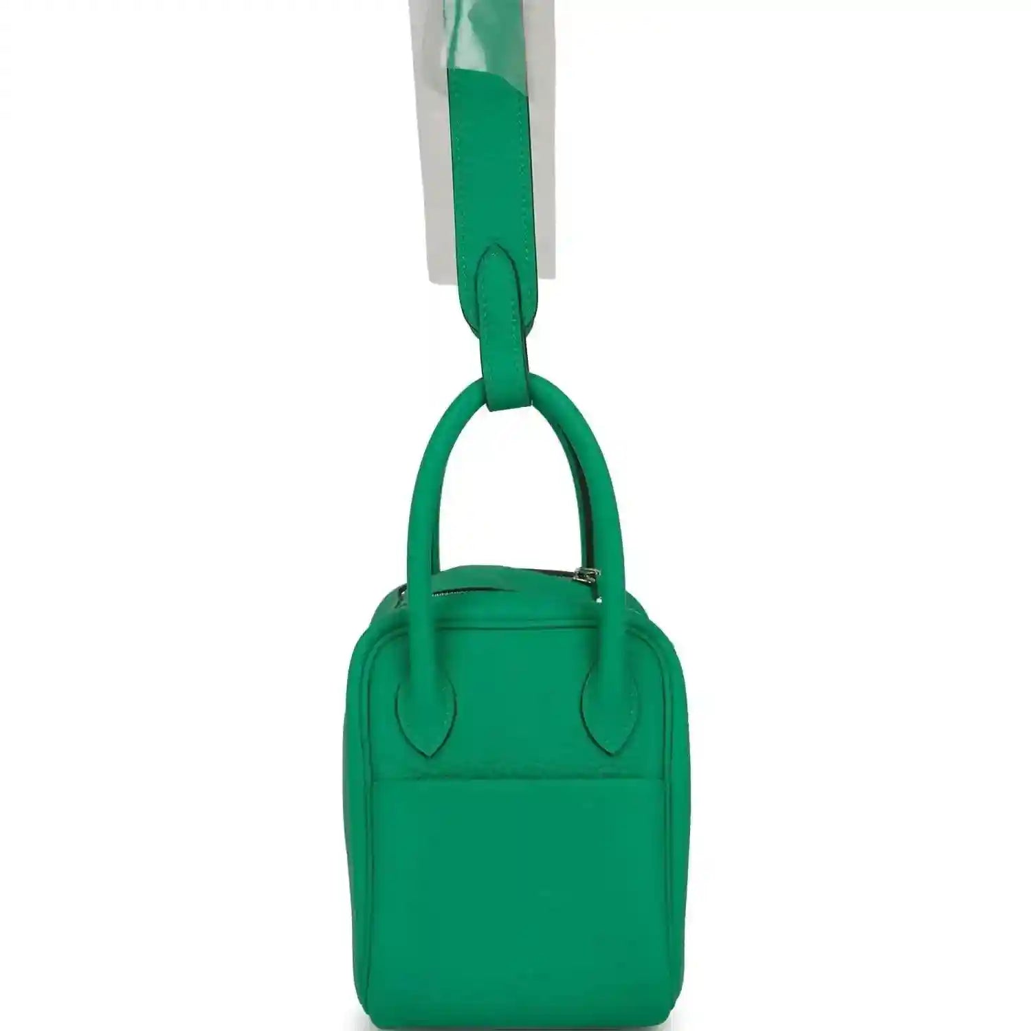 Mini green leather handbag with two short handles and compact body