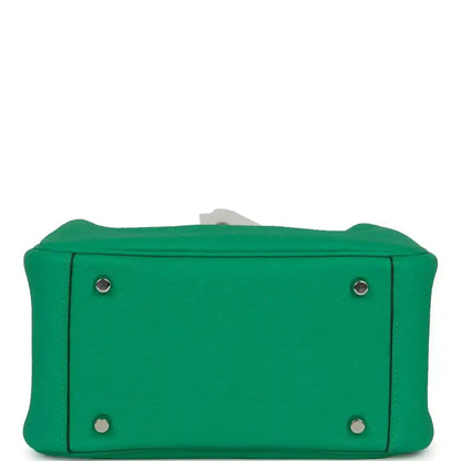 Mini green leather handbag base with four metal feet