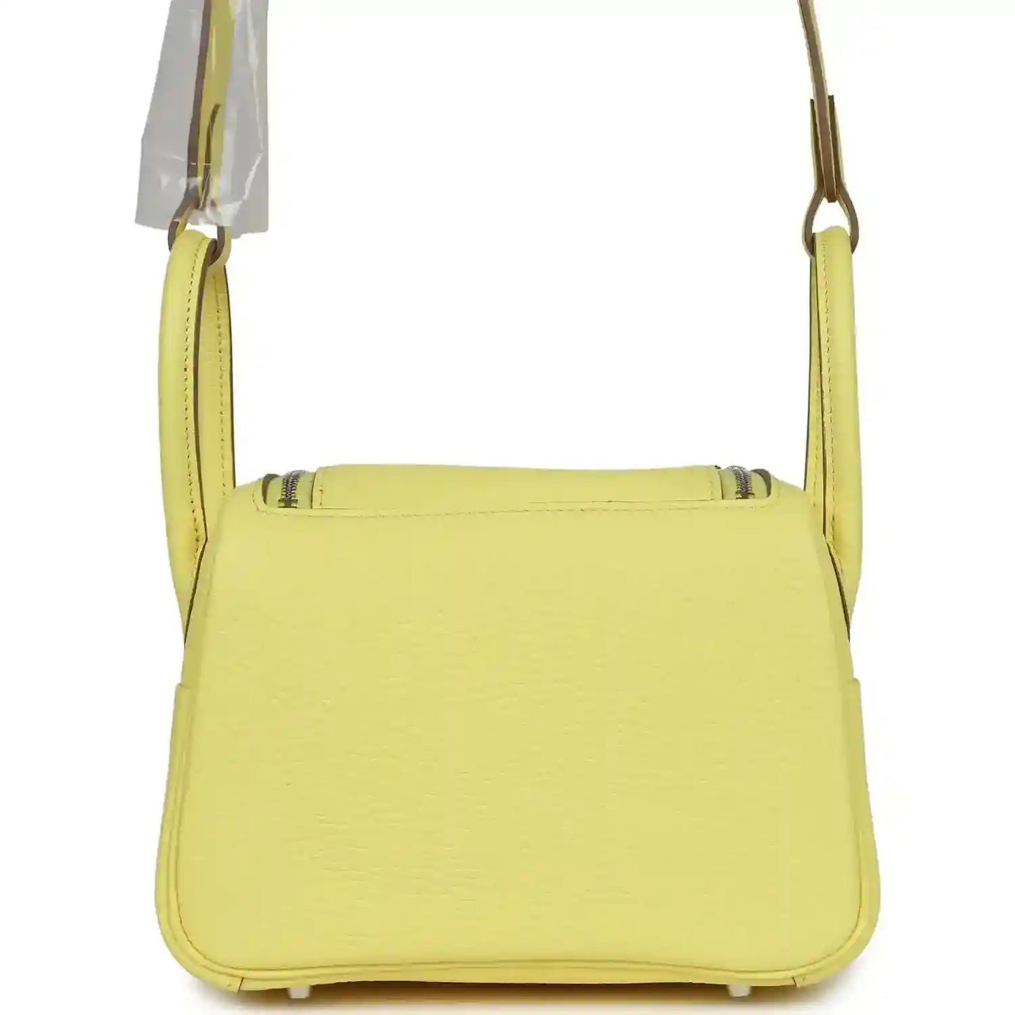 Hermes mini Lindy handbag in textured yellow leather, front view with top flap.
