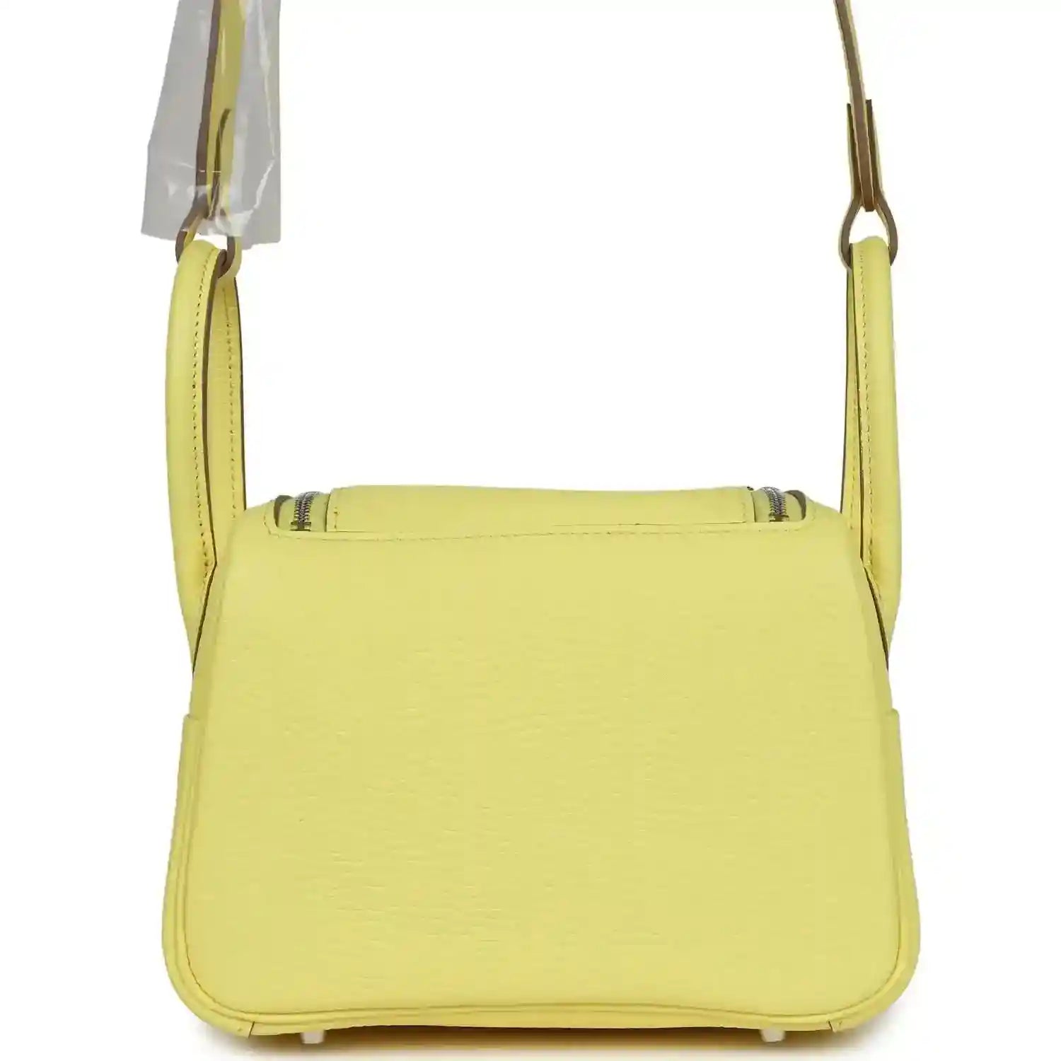 Hermes mini Lindy handbag in textured yellow leather, front view with top flap.
