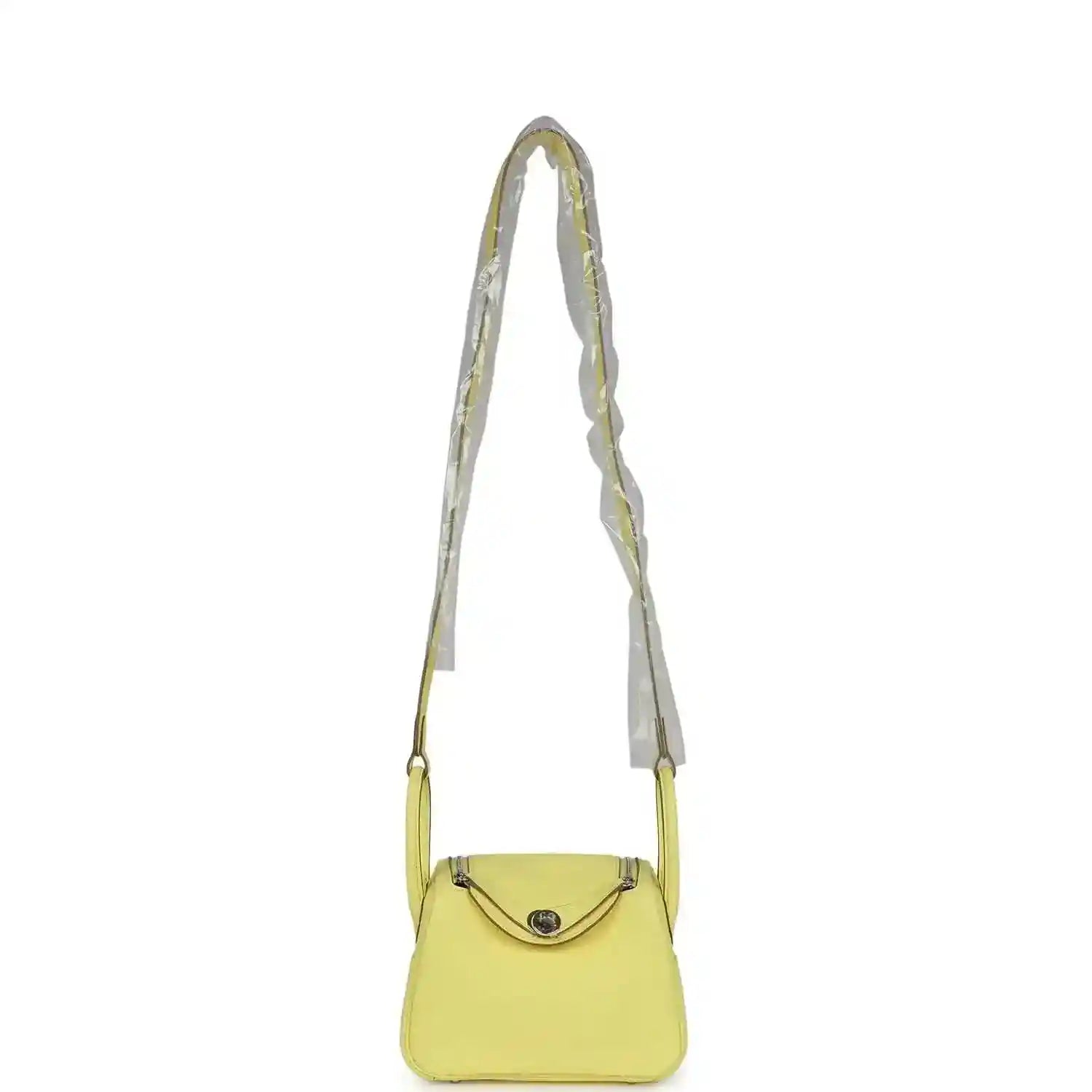 Hermes mini Lindy handbag in textured yellow leather with long shoulder strap and flap.