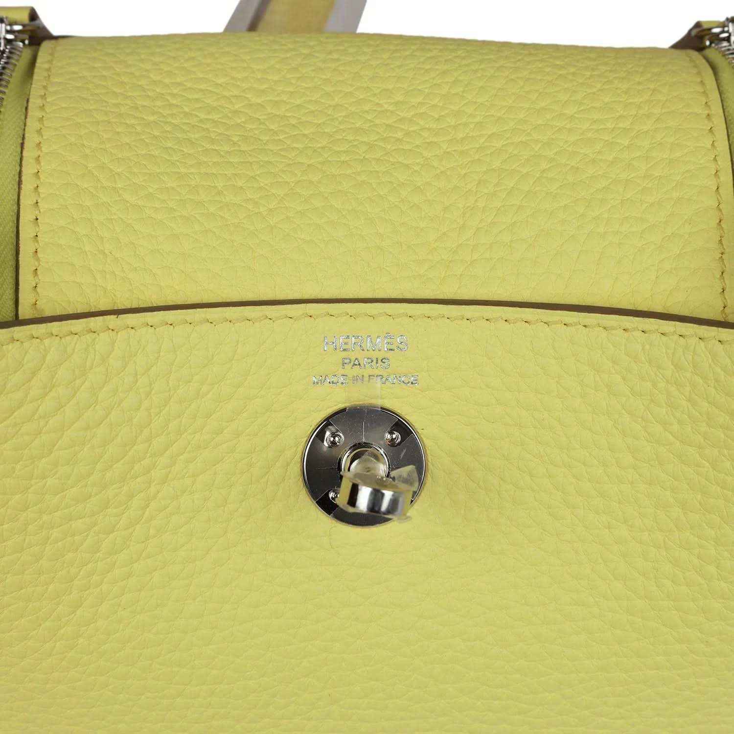 Hermes mini Lindy handbag in textured yellow leather, front flap snap and stamping.