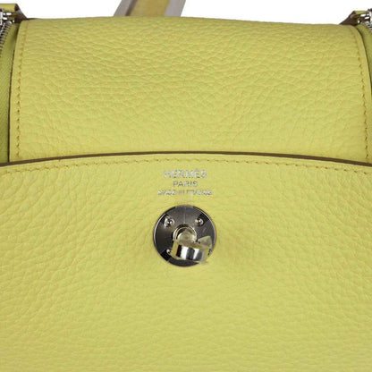 Hermes mini Lindy handbag in textured yellow leather, front flap snap and stamping.