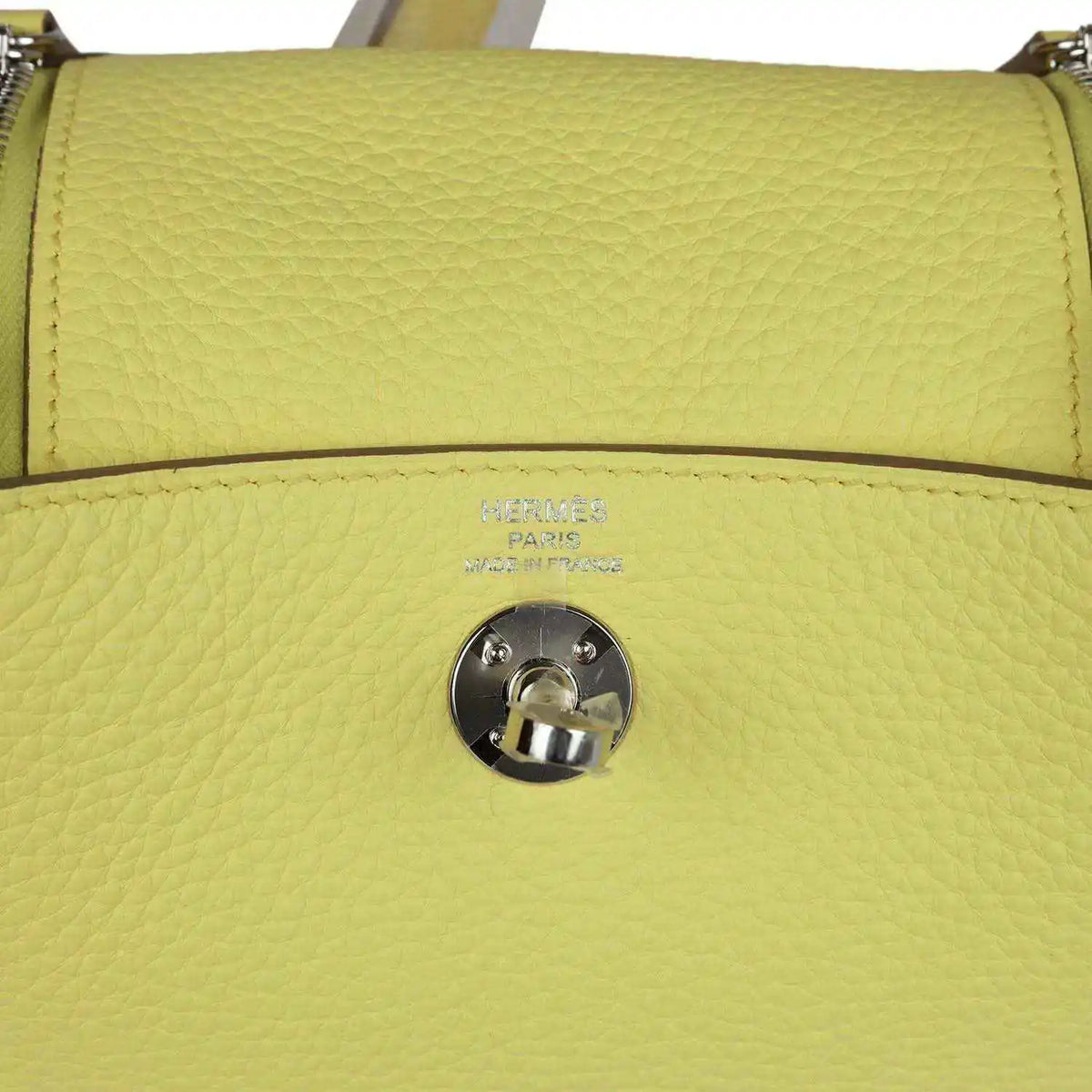 Hermes mini Lindy handbag in textured yellow leather, front flap snap and stamping.