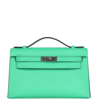 Hermes Kelly pochette green leather with top handle and front clasp, palladium hardware