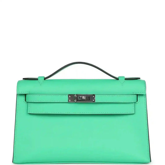 Hermes Kelly pochette green leather with top handle and front clasp, palladium hardware