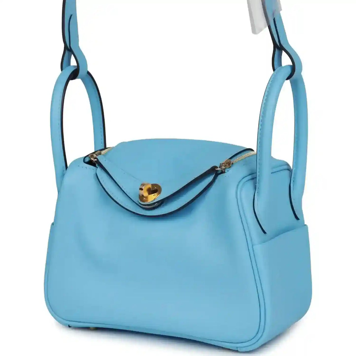 Mini light blue leather handbag with front flap, gold-tone clasp, and strap loops