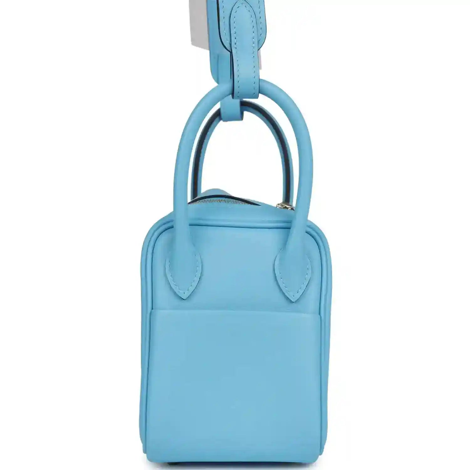 Light blue leather mini handbag with top carry handles and central seam detail