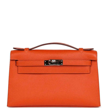 Orange Epsom leather clutch with top handle and front flap, silver-tone lock hardware