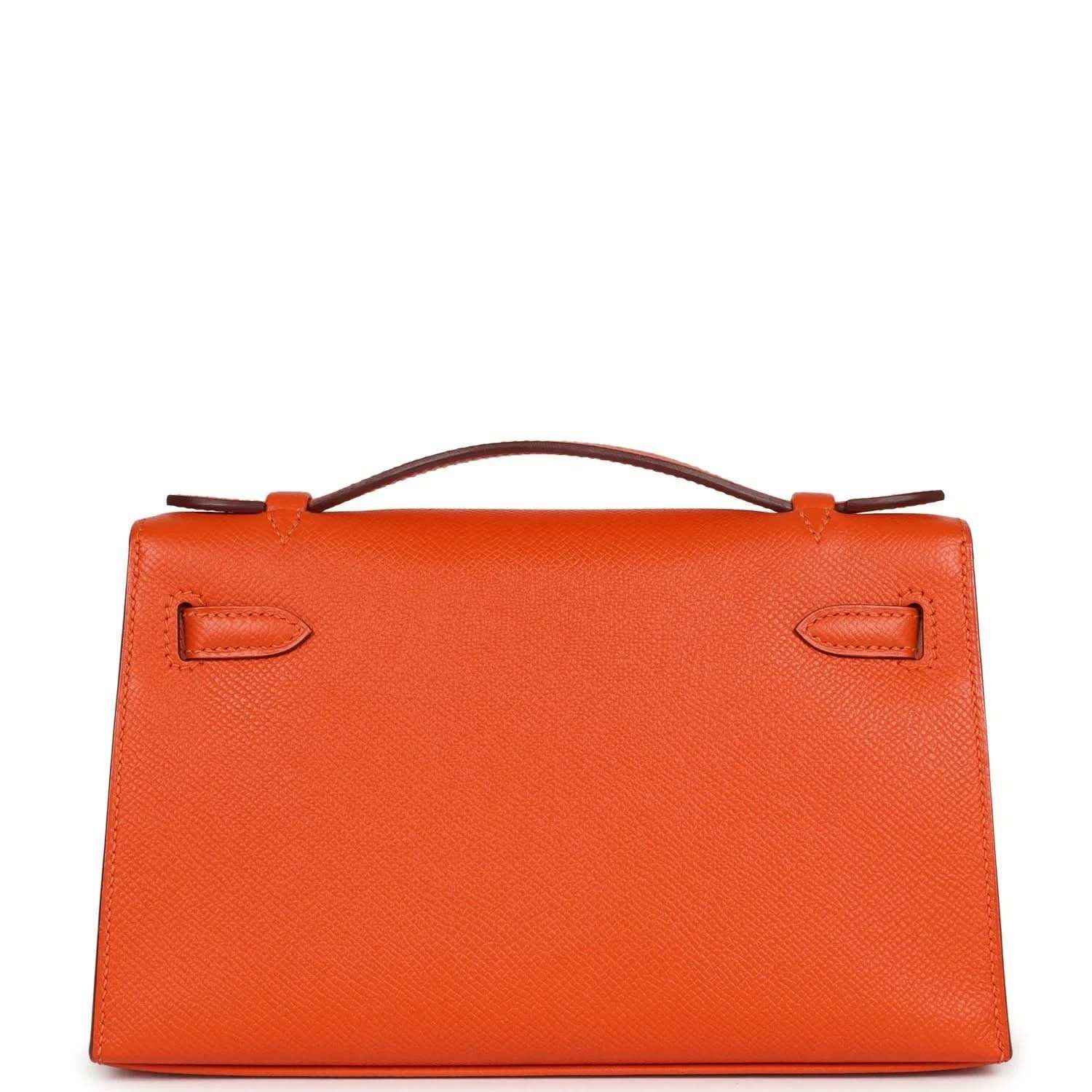Orange Epsom leather clutch front with top handle and two flap corner straps
