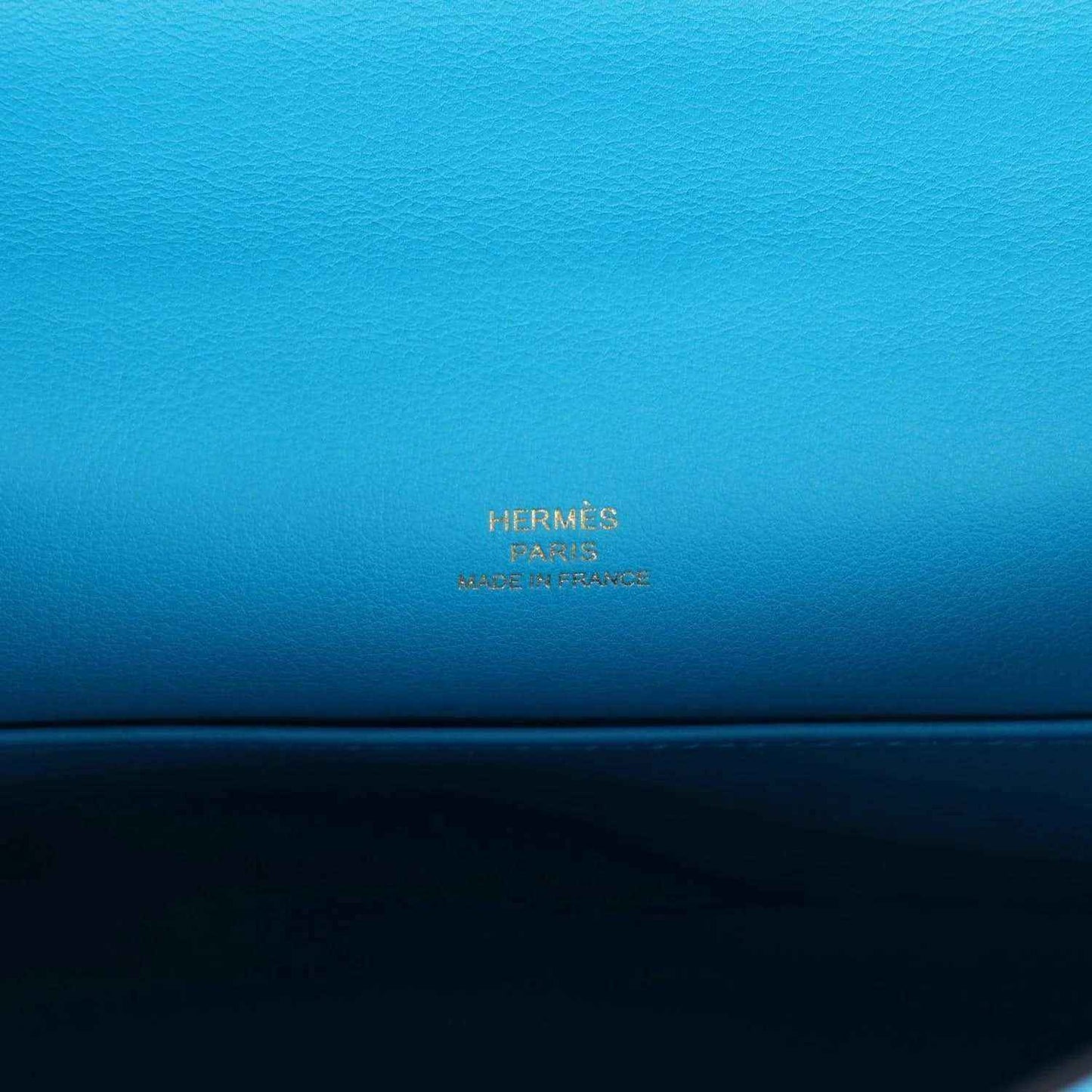 Hermes leather pochette handbag interior with stamped Hermes Paris branding