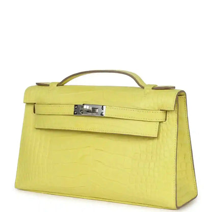 Lime alligator Kelly clutch with top handle, front flap and curved side