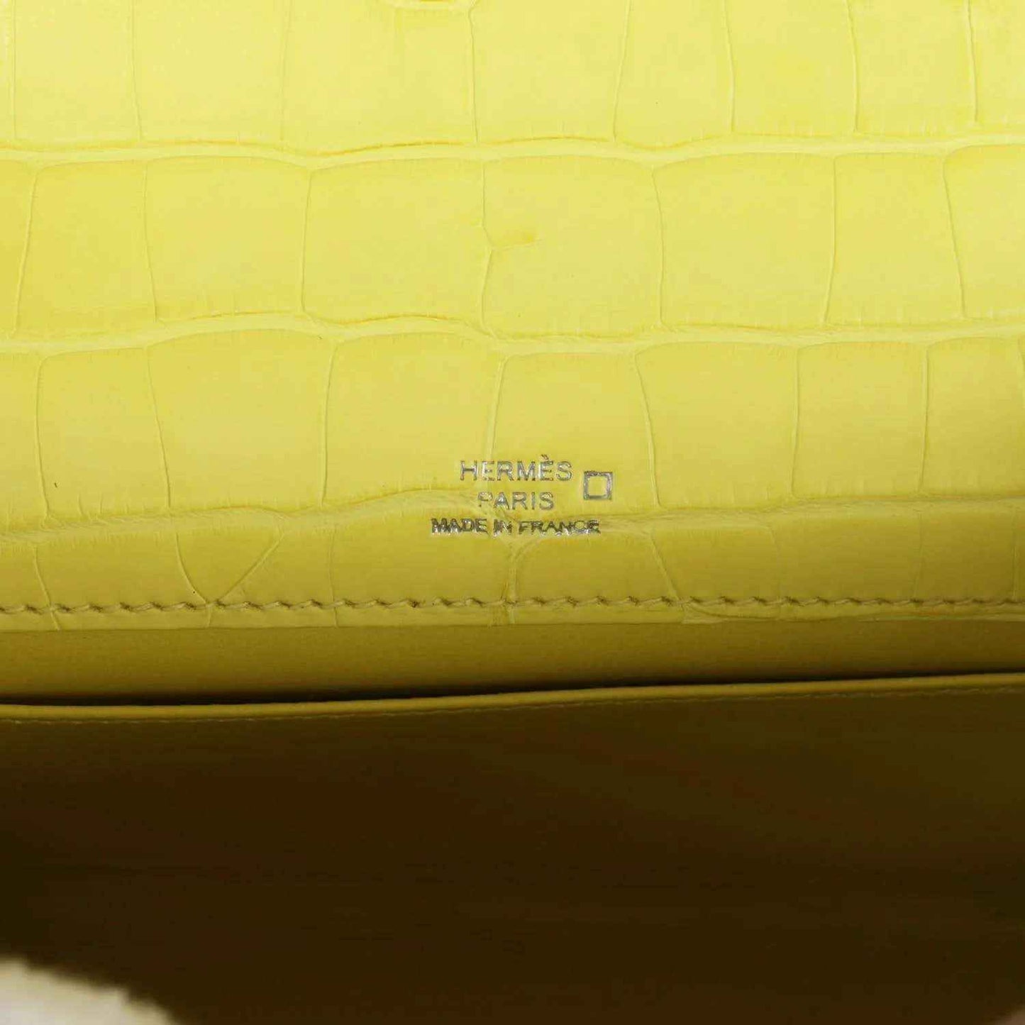 Hermes Paris stamped on lime alligator interior seam