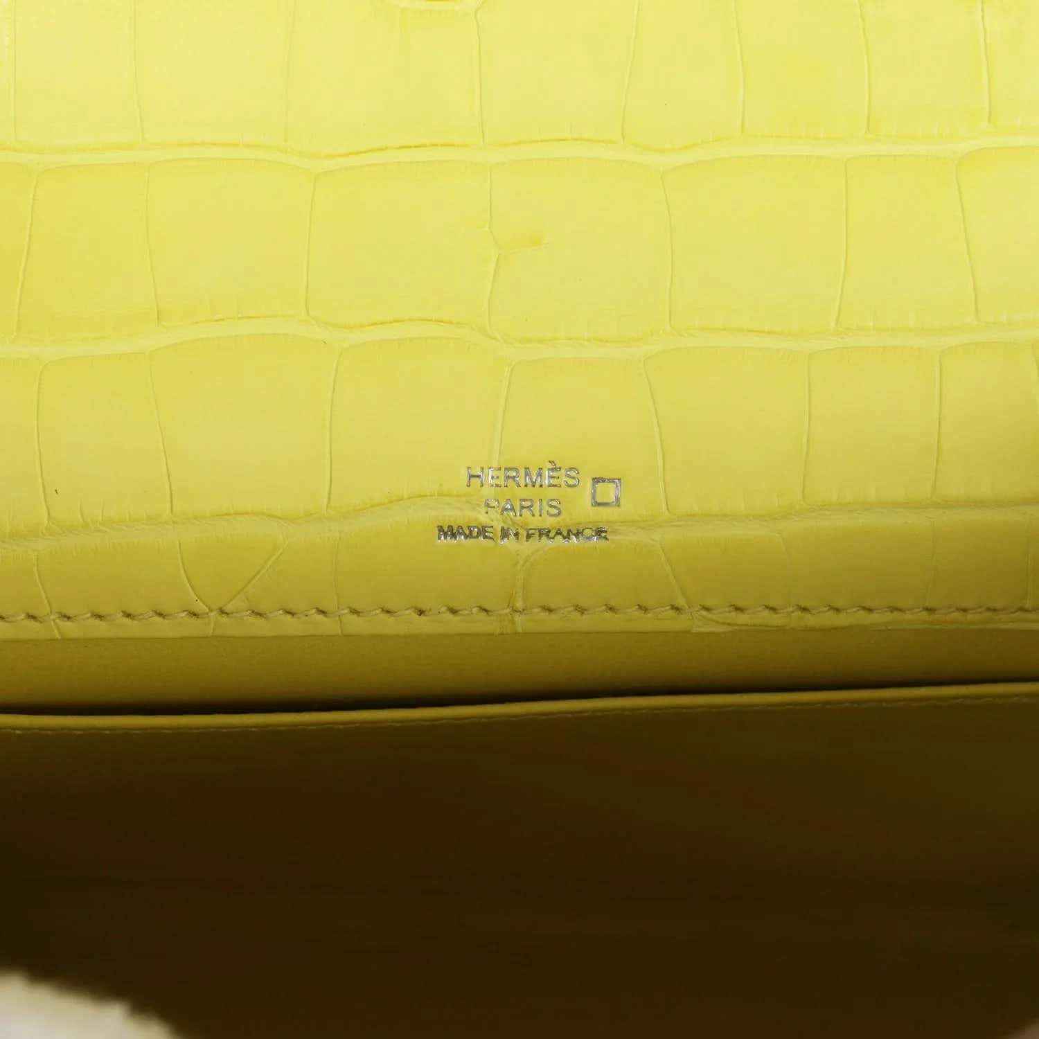 Hermes Paris stamped on lime alligator interior seam