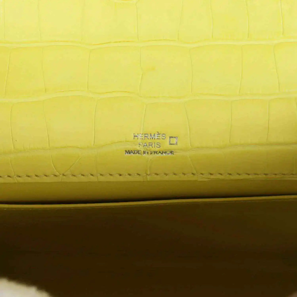 Hermes Paris stamped on lime alligator interior seam