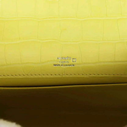 Hermes Paris stamped on lime alligator interior seam