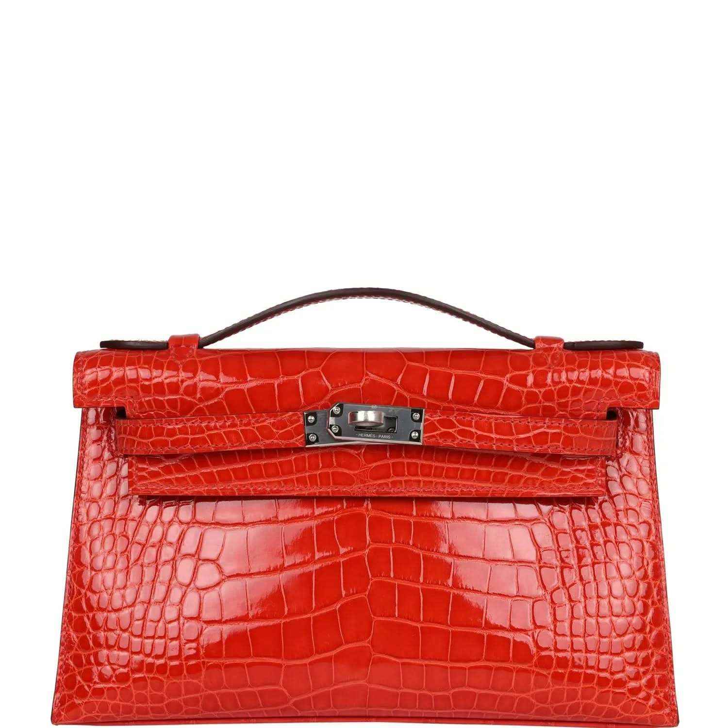 Orange crocodile-texture Kelly pochette with top handle and front clasp hardware