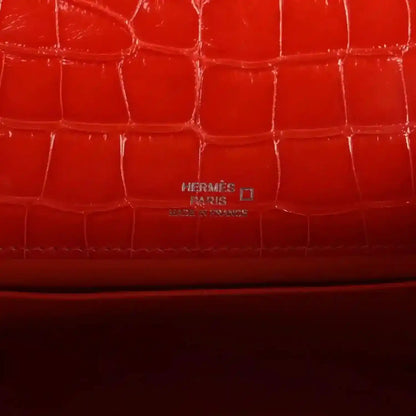 Orange crocodile-texture lining with embossed Hermes Paris mark