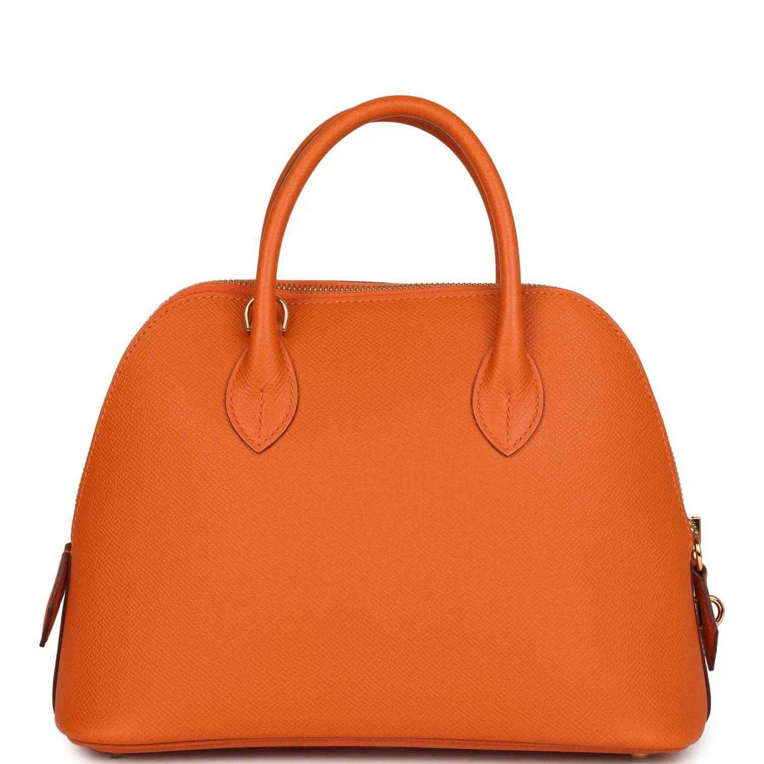Orange leather handbag front view with dual top handles and decorative strap detail, gold hardware.