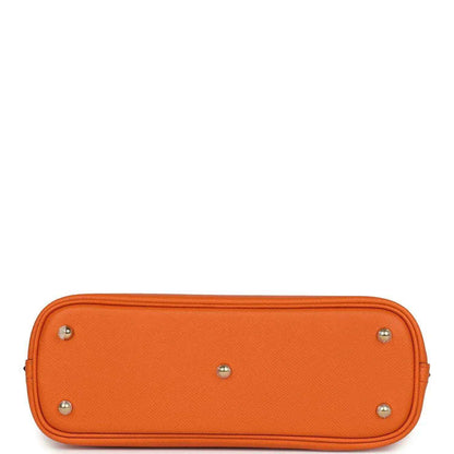 Orange leather handbag base with four silver-toned feet and smooth top edge.