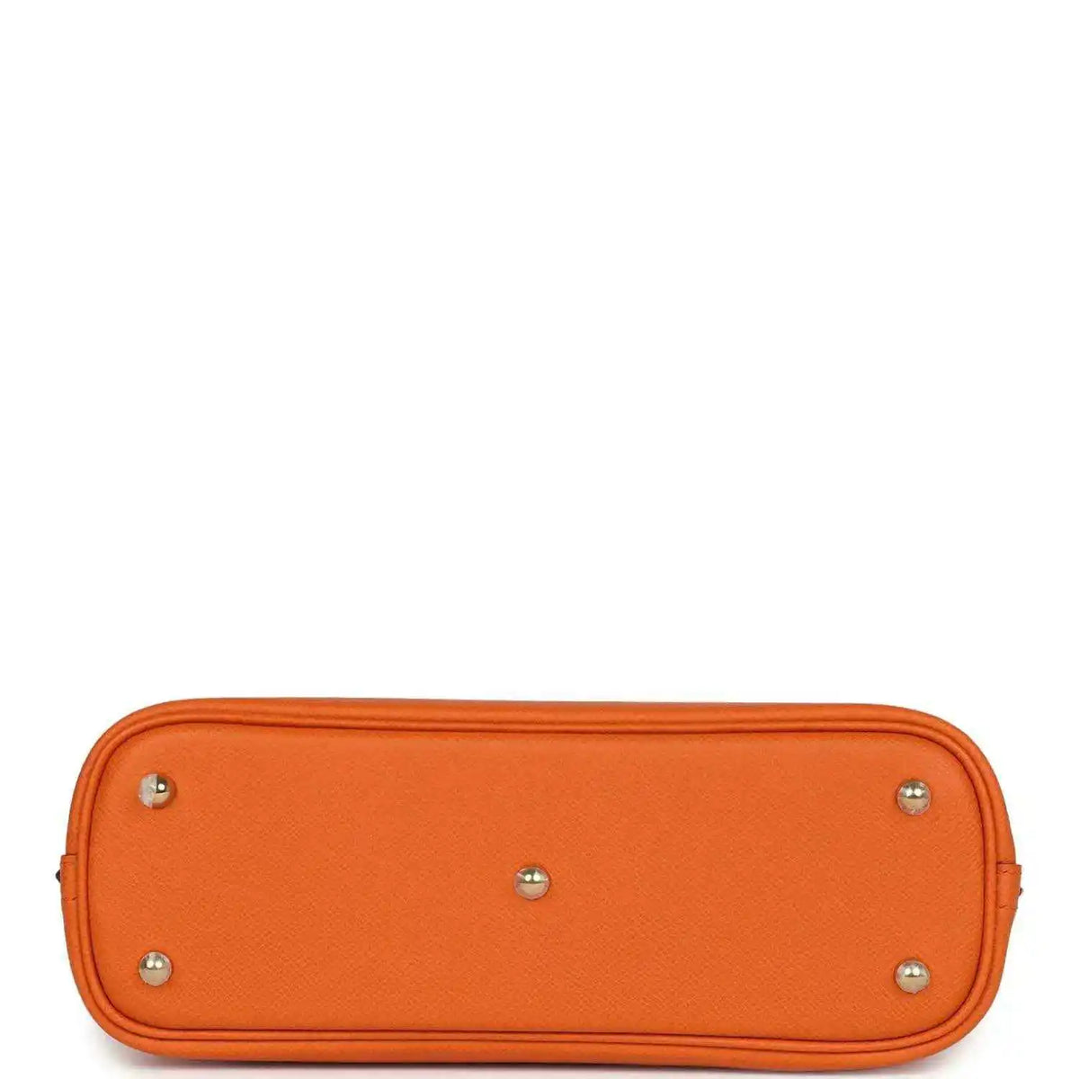 Orange leather handbag base with four silver-toned feet and smooth top edge.