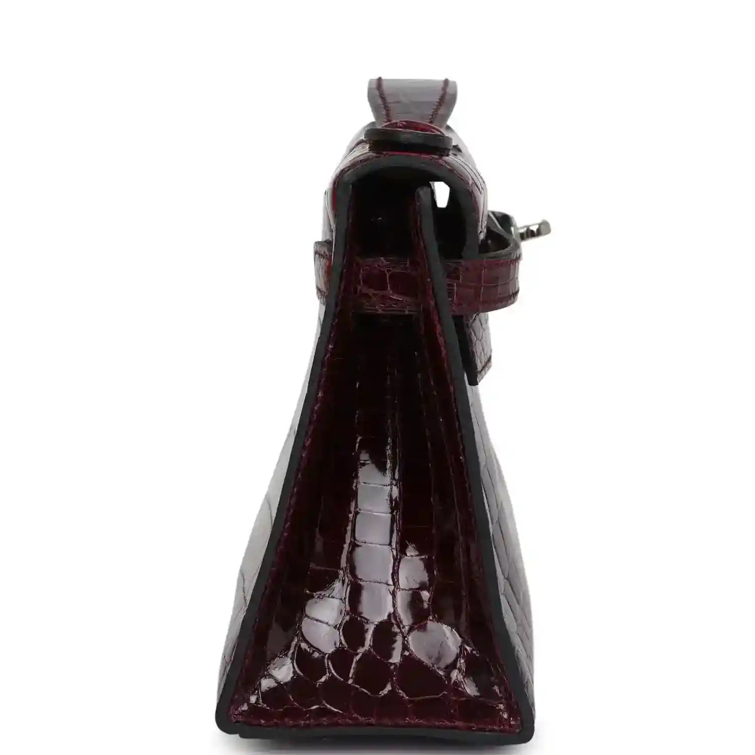 Burgundy crocodile-pattern handbag side view with strap and hardware detail