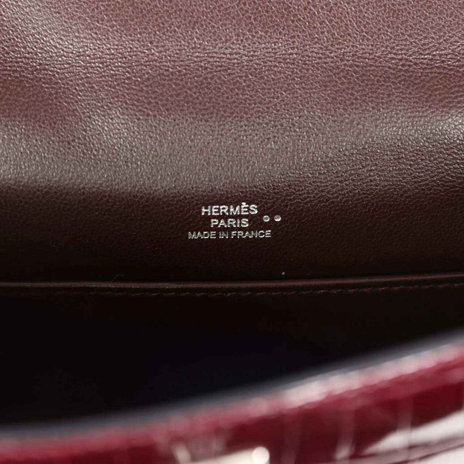 Hermès Paris stamp on burgundy handbag interior leather lining