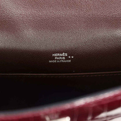 Hermès Paris stamp on burgundy handbag interior leather lining